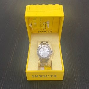 Invicta watch in original box with instruction book. Only worn one time.